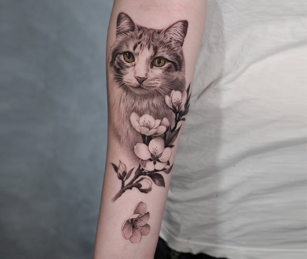 Black and grey memorial cat portrait tattoo by Jose Contreras in Austin, Texas Cat Tattoos in Austin: Honoring Feline Bonds with Ink & Memory. Black and grey memorial cat portrait tattoo by Jose Contreras in Austin, Texas